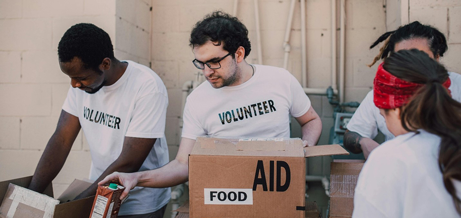 Volunteers packing boxes with donations